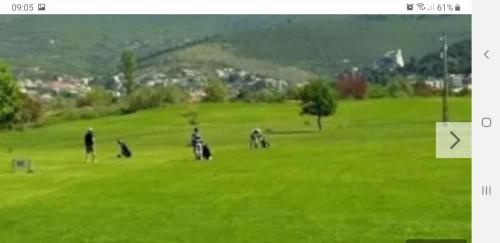 a group of people riding motorcycles on a green field at Luxury Apartments Mia in Podstrana
