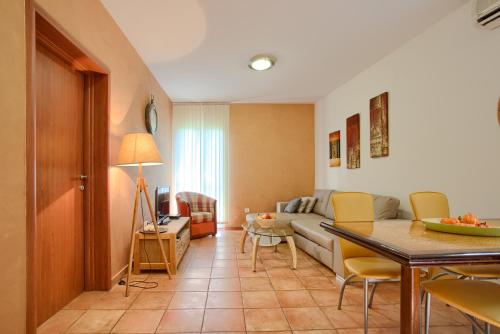 a living room with a couch and a table at Apartments Ivanović in Kotor