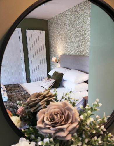Katil atau katil-katil dalam bilik di Anglesey Hotel