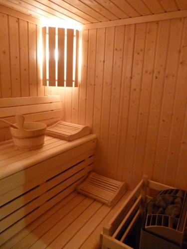 a inside of a sauna with a light on at Hôtel Belalp in Châtel