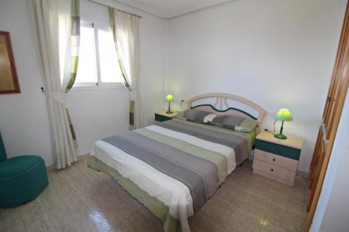 a bedroom with a large bed and a window at Veramar 6 in Vera