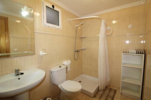 a bathroom with a toilet and a sink and a shower at Veramar 6 in Vera