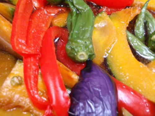 a pile of peppers and other vegetables are shown at Lodge Matsuya in Nozawa Onsen