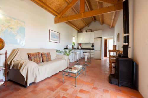 a living room with a couch and a table at Casa da Praia em Valadares in Vila Nova de Gaia