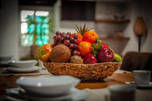 a basket of fruit sitting on a table at Los Lirios Hotel Rural - Adults Only in Tías