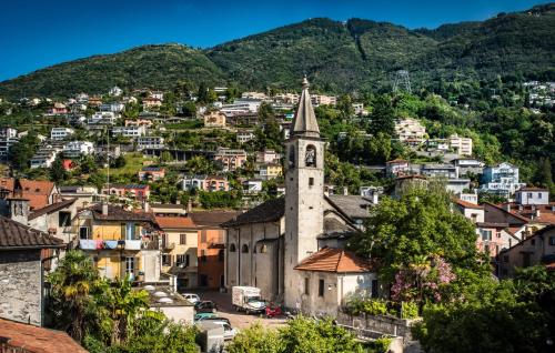 a view of a town with a church at Residenze dell'Angelo in Locarno