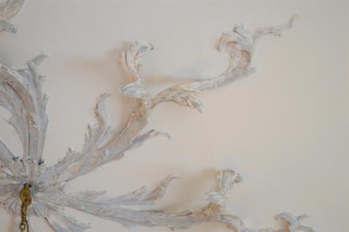 a white wall with a metal design on it at Henrietta Suites City Centre in Dublin
