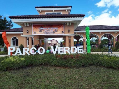 a house with a sign in front of it at Hillview Apt w/ Pool Access - Free Wifi in Tagbilaran City