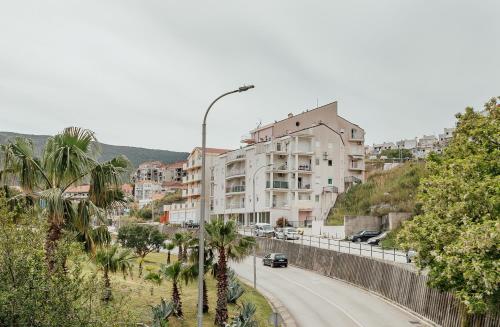 a street with a building on the side of a road at Boka View in Igalo