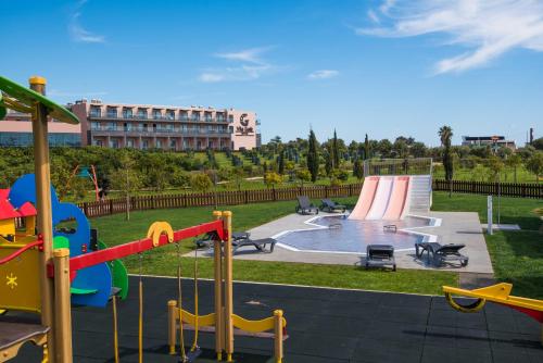 a playground with a slide in a park at Vila Gale Lagos in Lagos