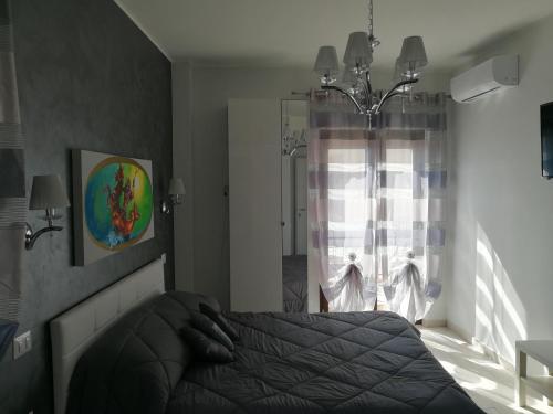 Ένα ή περισσότερα κρεβάτια σε δωμάτιο στο B&B Il Mare degli Dei