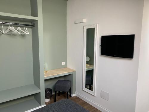 TV a/nebo společenská místnost v ubytování Residence Cavour 63