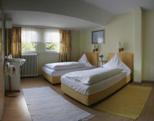 En eller flere senger på et rom på Hotel Eilenriede