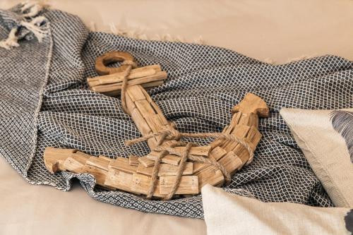 a bunch of wooden crosses on a blanket at B&B I Cinque Mori in Baunei