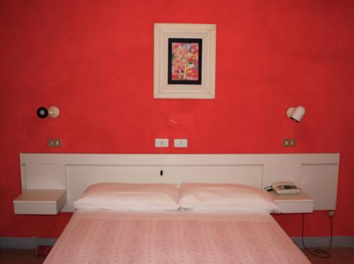 Postel nebo postele na pokoji v ubytování Albergo Villa Dionori