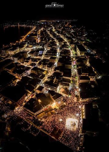 an aerial view of a large crowd of people at night at Cosy apartment in the heart of the city centre in Zakynthos Town