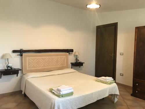 Postel nebo postele na pokoji v ubytování Villa Sa Curcurica