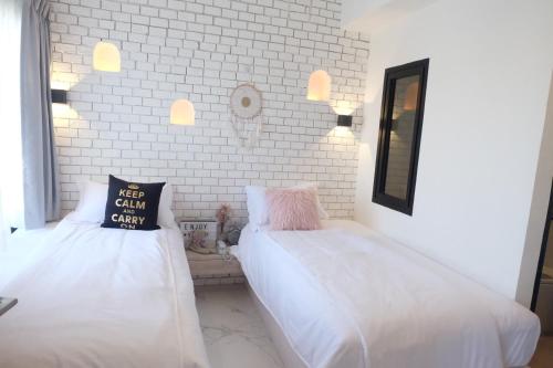 Katil atau katil-katil dalam bilik di Bonne Nuit Hotel, Hua Hin
