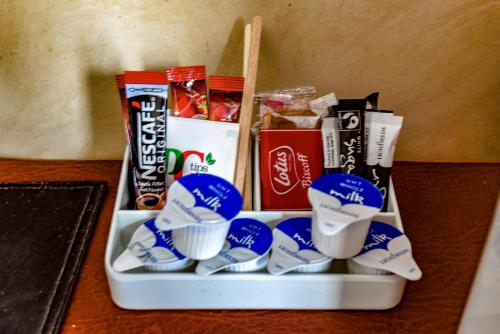 a tray filled with toothbrushes and other food at Aarondale Guest House in Hartlepool
