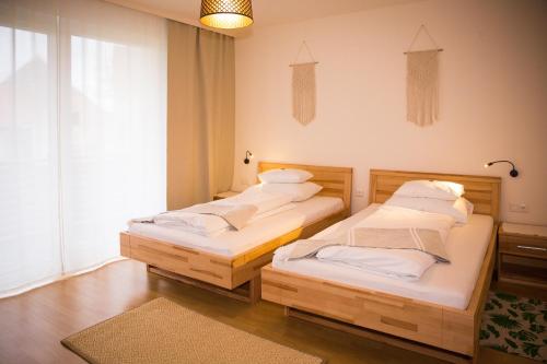 Кровать или кровати в номере Pension Schüssler