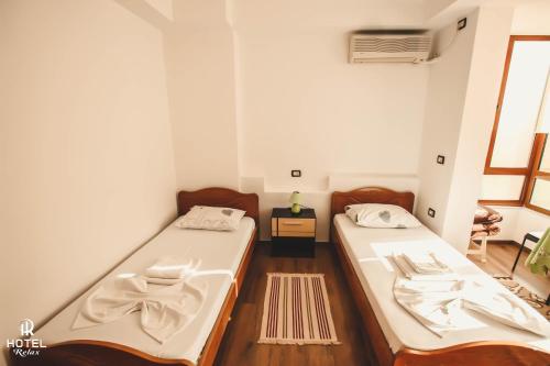 Cama o camas de una habitación en Hotel Relax