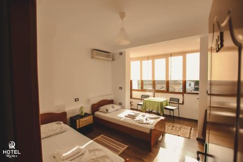 Postel nebo postele na pokoji v ubytování Hotel Relax