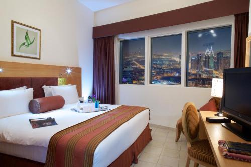 Giường trong phòng chung tại Tamani Marina Hotel & Apartments