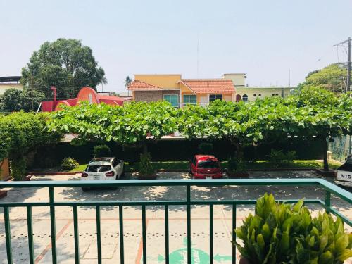 a view of a parking lot with cars parked at Villa Esmeralda in San Juan Bautista Tuxtepec