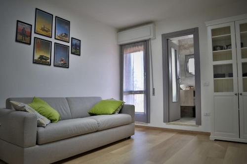 a living room with a couch and a window at La Casa di Luna in Borghetto Lodigiano
