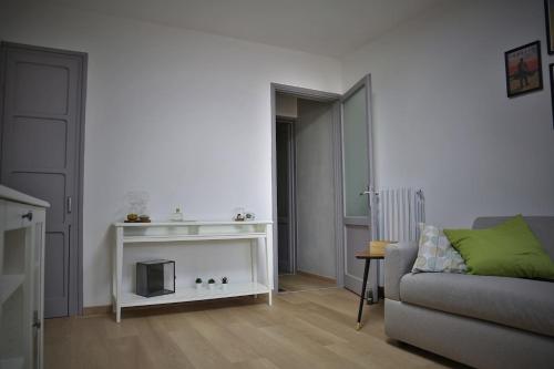 a living room with a couch and a fireplace at La Casa di Luna in Borghetto Lodigiano