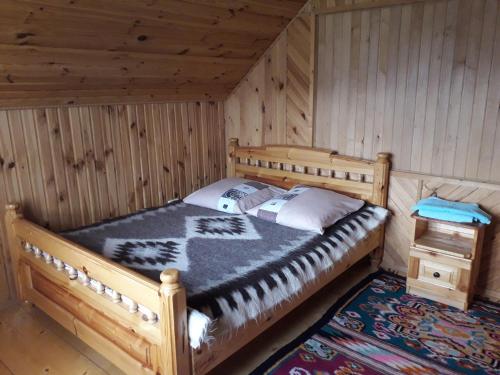 Ένα ή περισσότερα κρεβάτια σε δωμάτιο στο Вікенд