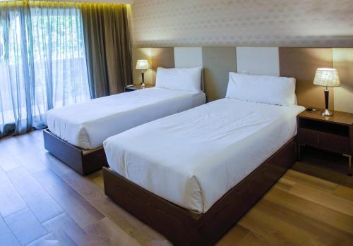 Postel nebo postele na pokoji v ubytování Avellaneda Aparts & Suites