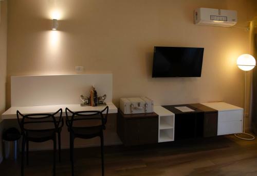 TV a/nebo společenská místnost v ubytování Avellaneda Aparts & Suites