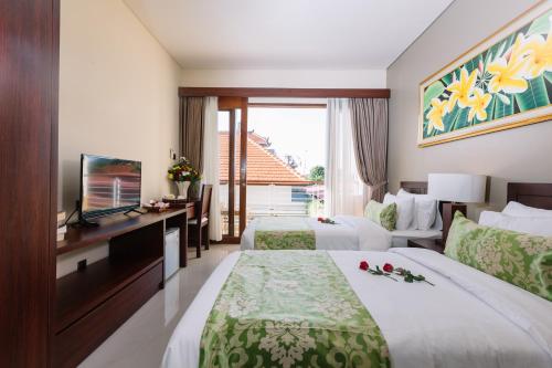 Postel nebo postele na pokoji v ubytování Kubu Benoa Guest House