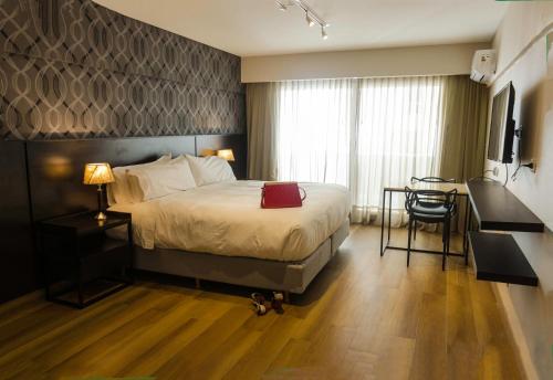 Postel nebo postele na pokoji v ubytování Avellaneda Aparts & Suites
