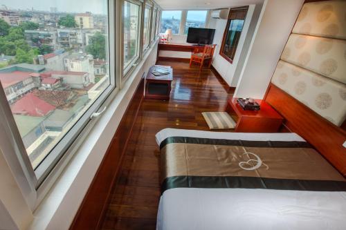 Кровать или кровати в номере Conifer Boutique Hotel