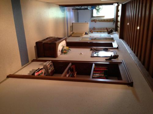 a room with a room with a desk and a room with a room at Haus Tenk in Mittersill