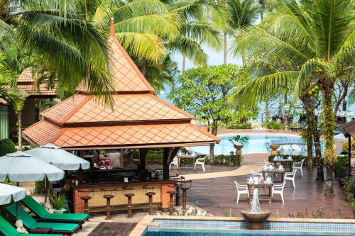 a view of a resort with a pool and a bar at Khaolak Bayfront Resort in Khao Lak