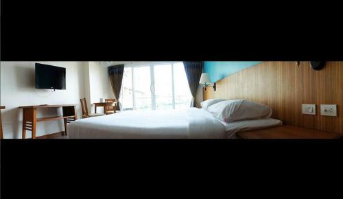 Кровать или кровати в номере D Apartment