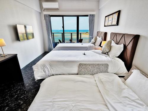 Ένα ή περισσότερα κρεβάτια σε δωμάτιο στο Beach Front Tower Mihama by DSH