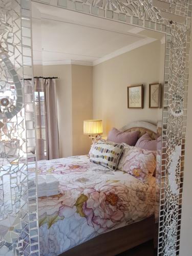 a bedroom with a bed with a glass wall at MyAula in Tierpoort