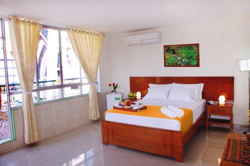 A bed or beds in a room at Del Castillo Plaza Hotel Pucallpa