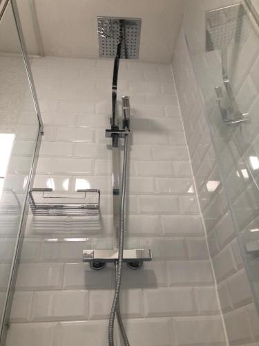 a shower in a bathroom with a glass wall at Coverdale in Lyme Regis