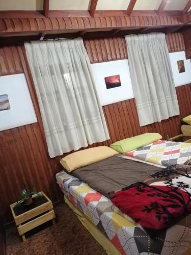 Ένα ή περισσότερα κρεβάτια σε δωμάτιο στο Tiger House Guest House
