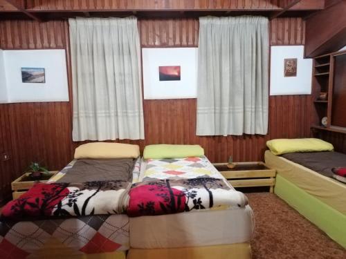 Ένα ή περισσότερα κρεβάτια σε δωμάτιο στο Tiger House Guest House