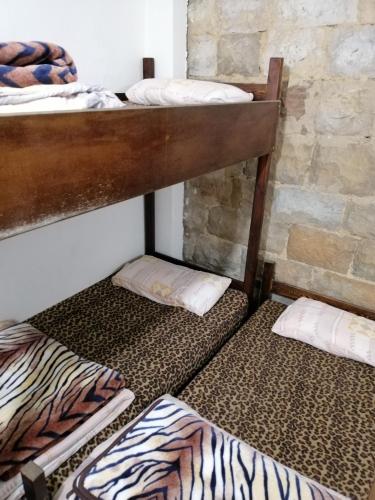 Ένα ή περισσότερα κρεβάτια σε δωμάτιο στο Tiger House Guest House