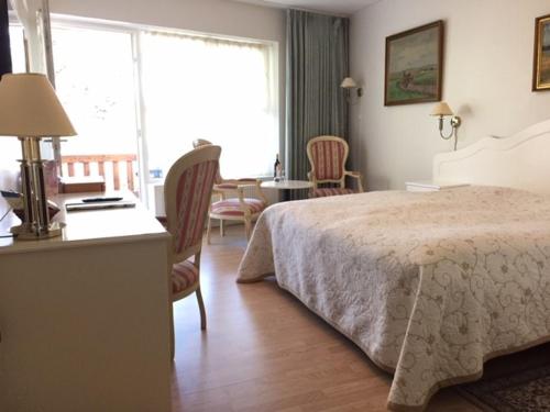 Postel nebo postele na pokoji v ubytování Hotel Laasby Kro