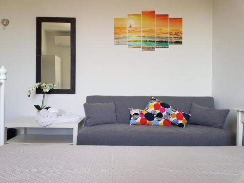 a living room with a couch and a table at B&B Villa Giulia in Desenzano del Garda