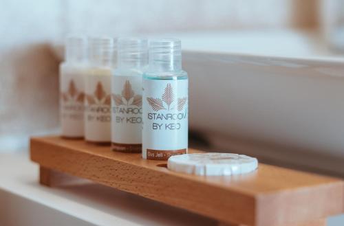 a shelf with four bottles of milk on it at Istanroom by Keo in Istanbul