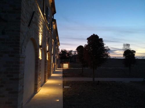 a building with lights on the side of it at Villa Angela Country House in Fermo